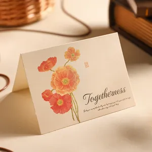 Vintage kraft paper greeting card with orange poppy flowers and Togetherness text.