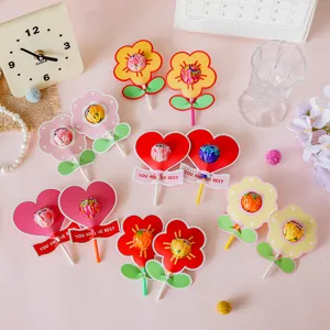 Detailed view of colorful flower and heart-shaped lollipop decorative paper cards for kids.