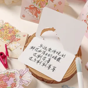Detailed view of a white folding greeting card with a handwritten romantic Chinese poem