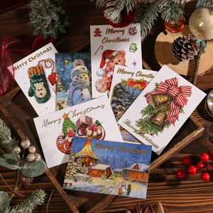 Surtido de tarjetas de felicitación navideñas con estampado dorado y motivos festivos.