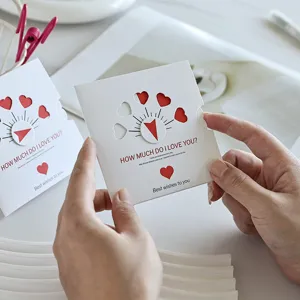 Close-up of a creative rotating heart greeting card with hollow-out design and wishes.