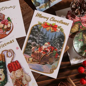 Detalle de una tarjeta de Navidad con estampado dorado e ilustración de Papá Noel.