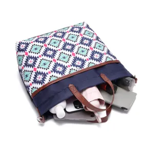Open view of Aztec pattern tote bag showing capacity for tablet, umbrella and makeup