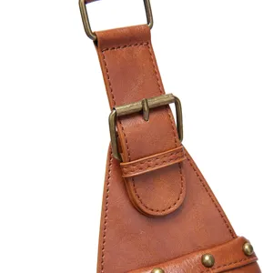 Detail view of the brown leather strap and vintage metal buckle on a Bohemian crossbody bag.