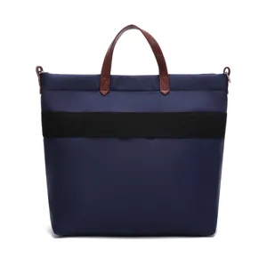 Front view of navy blue waterproof nylon tote bag with brown leather handles
