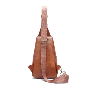 Back view of vintage bohemian brown sling bag with intricate floral printed strap