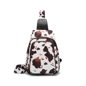 Retro Western cow print women's chest bag with adjustable sling strap and zipper details