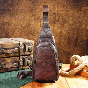 Detail of vintage brown embossed floral pattern on western style sling chest bag
