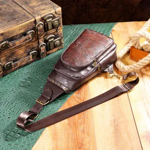 Vintage bohemian brown leather sling chest bag with floral embossing and metal studs