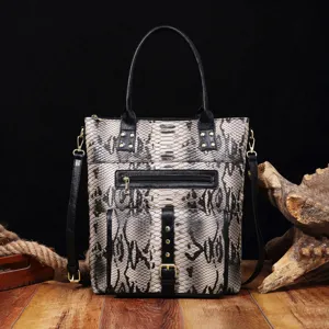 Detailed front view of a vintage style tote bag featuring bold snakeskin print and black handles
