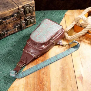 Detailed close-up view of vintage Western floral embossed leather sling bag for women