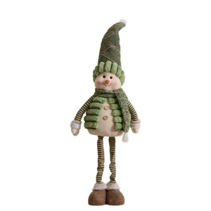 Handcrafted plush Christmas snowman doll ornament with green hat and striped legs