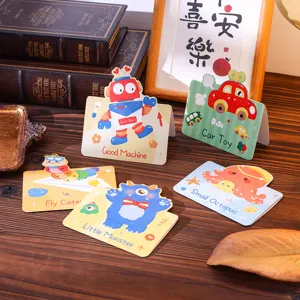 Close-up of colorful cartoon animal and vehicle message cards on a wooden table