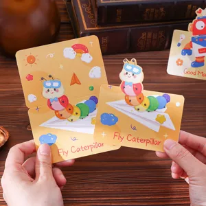 Close-up view of cute cartoon caterpillar and robot greeting cards for gifts and birthdays