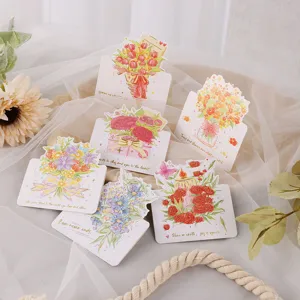 Vue détaillée de cartes de vœux florales avec dorure et citations inspirantes
