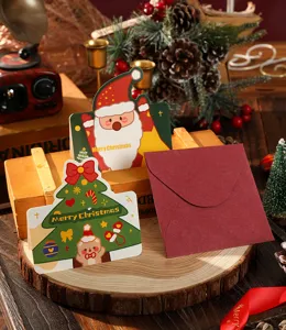 Christmas greeting cards with Santa and tree designs including a red envelope.