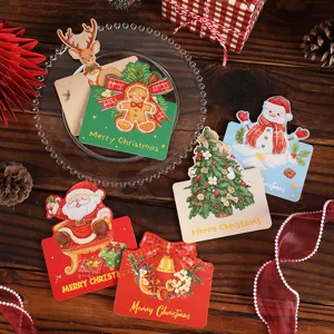 Detailed view of vintage Christmas gift tags featuring various holiday illustrations