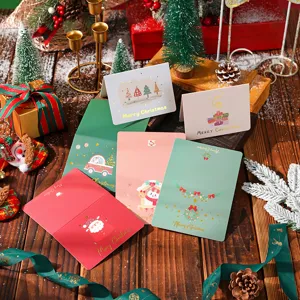 Set of premium Christmas greeting cards with gold stamping and holiday illustrations.