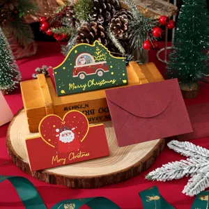Close-up of festive Christmas cards with gold foil accents and matching envelopes