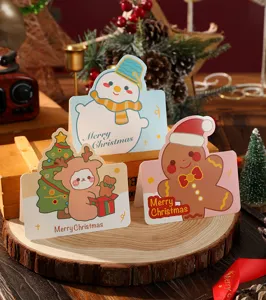 Detail of cute cartoon Christmas greeting cards featuring snowman and gingerbread man.