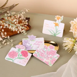 Detail view of four floral Mother's Day greeting cards on a gift setup