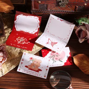 Detailed view of vintage three-fold greeting cards with cute bear and floral illustrations