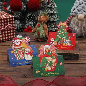 Set aus drei Vintage-Weihnachtskarten mit Weihnachtsmann, Schneemann und Baum-Motiven.