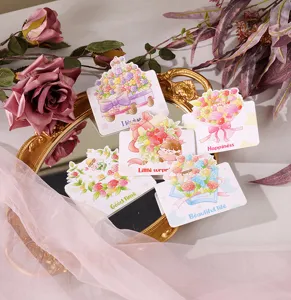 Collection of cartoon floral greeting cards displayed on a vintage gold mirror tray