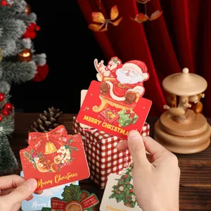 Detailed view of festive vintage Christmas gift tags with Santa and wreath designs