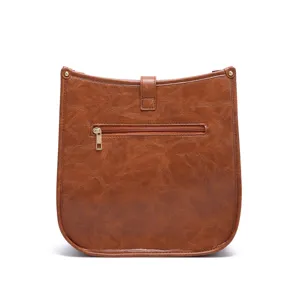 Back view of vintage brown crossbody bag featuring textured faux leather and zipper