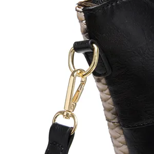 Detailed view of the golden metal clasp and snakeskin texture on a black retro tote bag