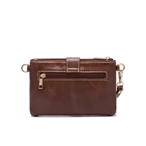 Front view of vintage brown western small crossbody bag with distinct yellow stitching