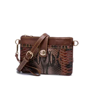 Retro bohemian small crossbody bag with snake skin texture and twist lock detail