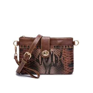 Detail of bohemian retro small crossbody bag with snakeskin print and golden turn-lock