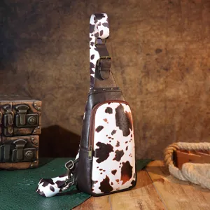 Vintage Western cow print sling bag featuring bohemian style chest pack details and texture