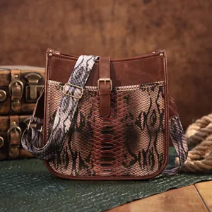 Vintage Bohemian shoulder bag featuring snakeskin print and rich brown leather trim
