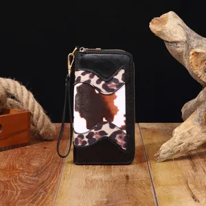 Detailansicht der Bohème-Geldbörse aus Kunstleder mit Leoparden- und Kuhfellmustern