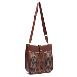 Full view of vintage Western crossbody bag with brown snakeskin print and buckle.