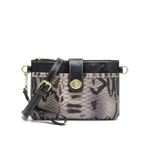 Close-up of vintage bohemian crossbody bag featuring snakeskin pattern and gold hardware