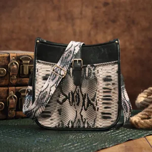 Vintage bohemian crossbody bag featuring a snakeskin print and adjustable strap design