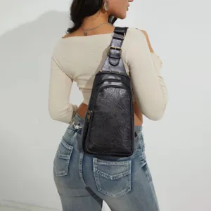 Vintage western embossed floral leather sling bag for women, bohemian chest pack design