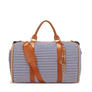 Bolsa de viaje grande de lona a rayas con asas de cuero PU marrón y detalle de borla