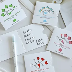 Detail view of creative hollow rotating greeting cards showing elegant handwritten blessings.