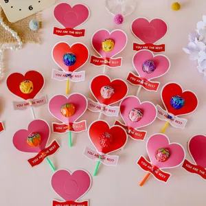 Heart-shaped lollipop paper holder cards with motivational text for candy decoration.