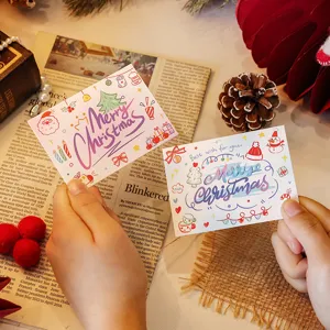 Detailed view of two cartoon Merry Christmas greeting cards with festive decorations