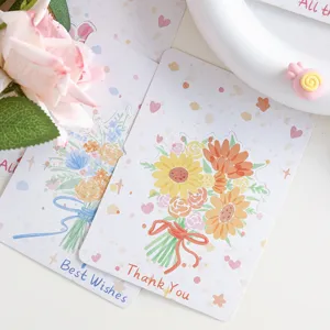 Detailaufnahme einer handgemalten Grußkarte mit Blumenstrauß und Thank You Aufschrift