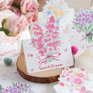 Nahaufnahme von handgezeichneten floralen Grußkarten mit 'Sweet Dream' Schriftzug
