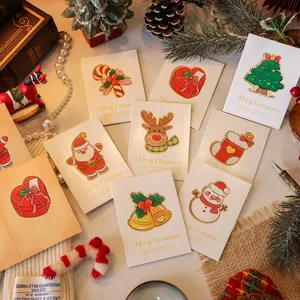 Set of assorted Christmas cards with cute festive character designs and warm lighting.