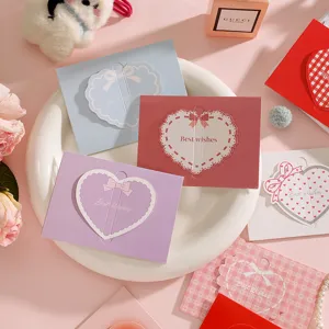 Verscheidenheid aan kleurrijke 3D-hart-wenskaarten met Best wishes-tekst.