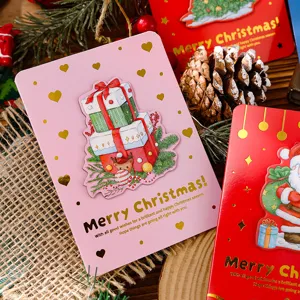 Detail view of 3D Christmas cards with gold foil gift box and Santa Claus designs